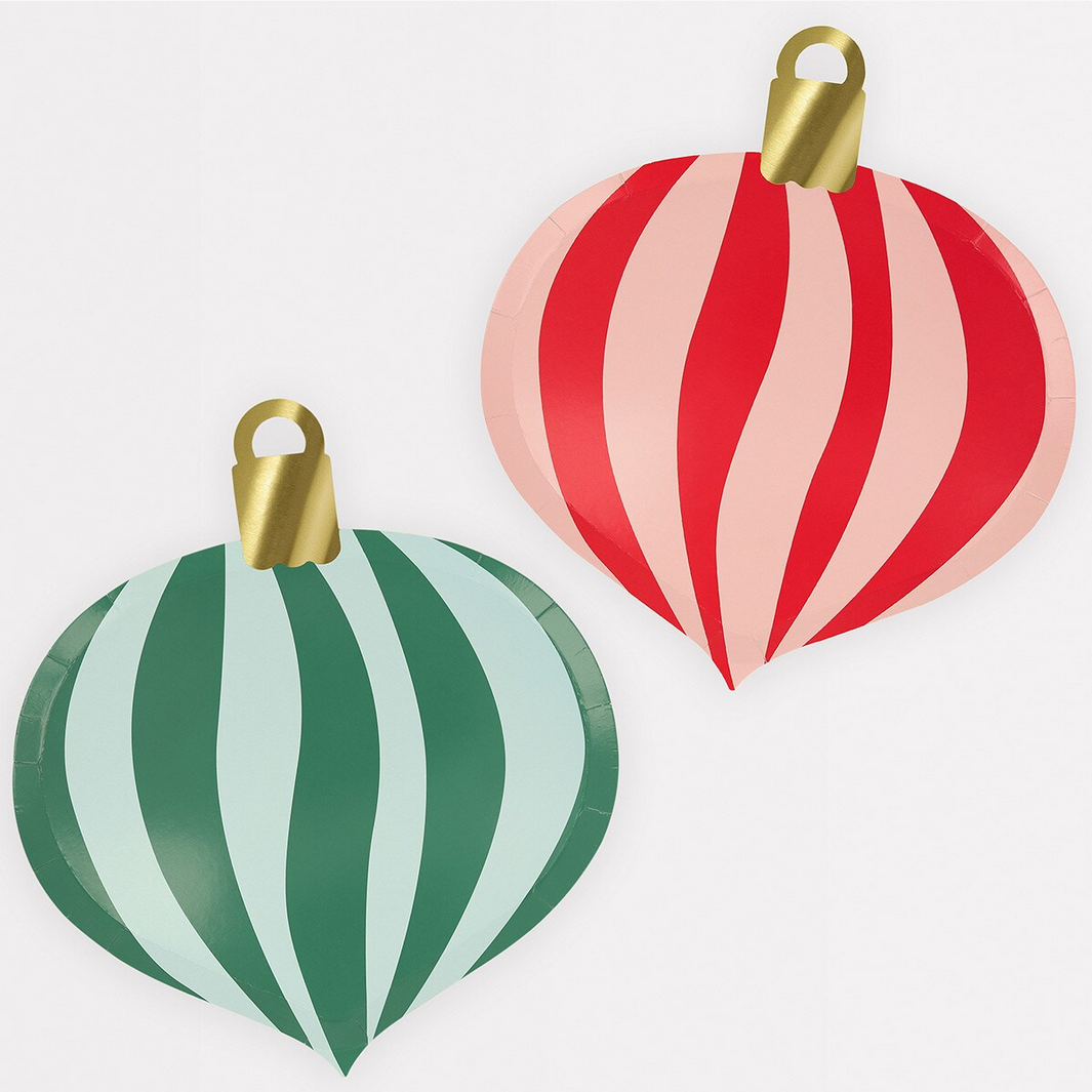 Two striped Christmas ornaments, one red and pink, one green and white, on a light gray background.