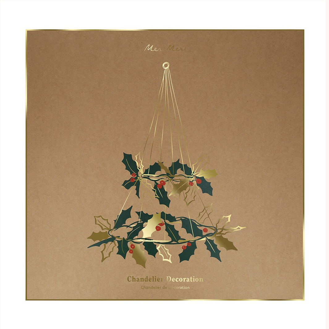 Chandelier decoration with holly leaves and berries on a brown background