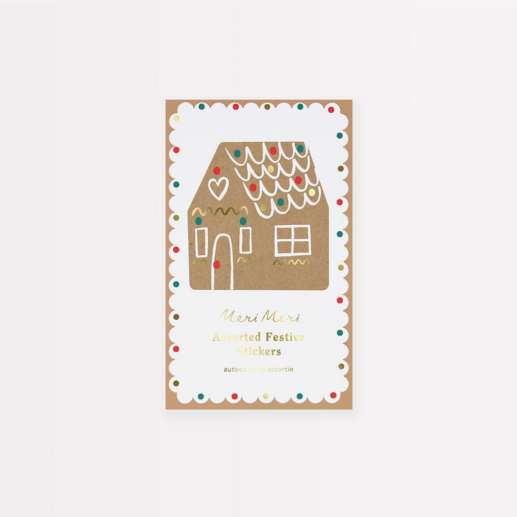 Packaging of Meri Meri stickers with a gingerbread house design on a white background