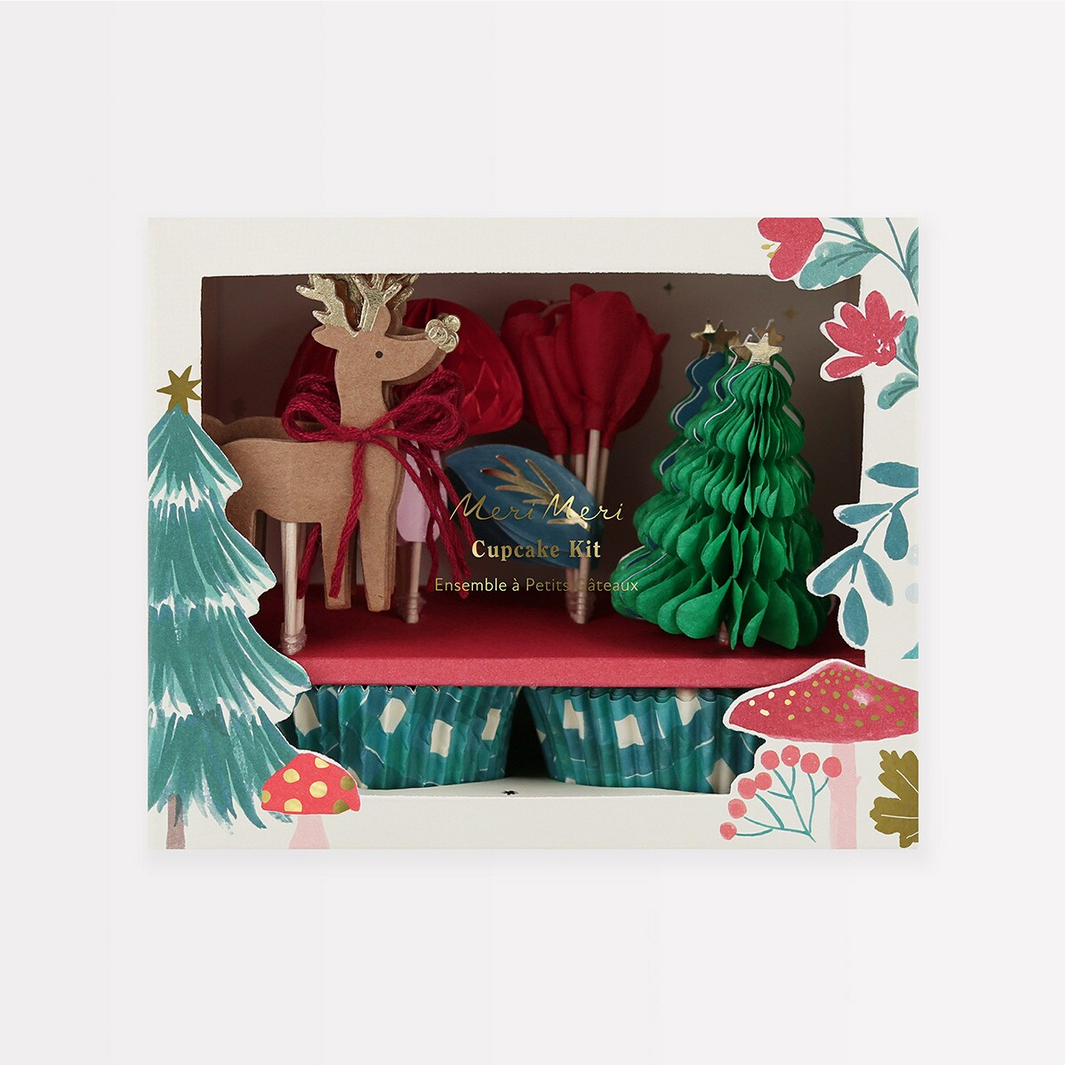 Cupcake kit with Christmas-themed decorations including trees and a reindeer in a decorative box.