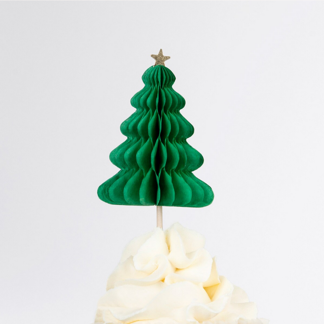 Green paper Christmas tree decoration on a white background