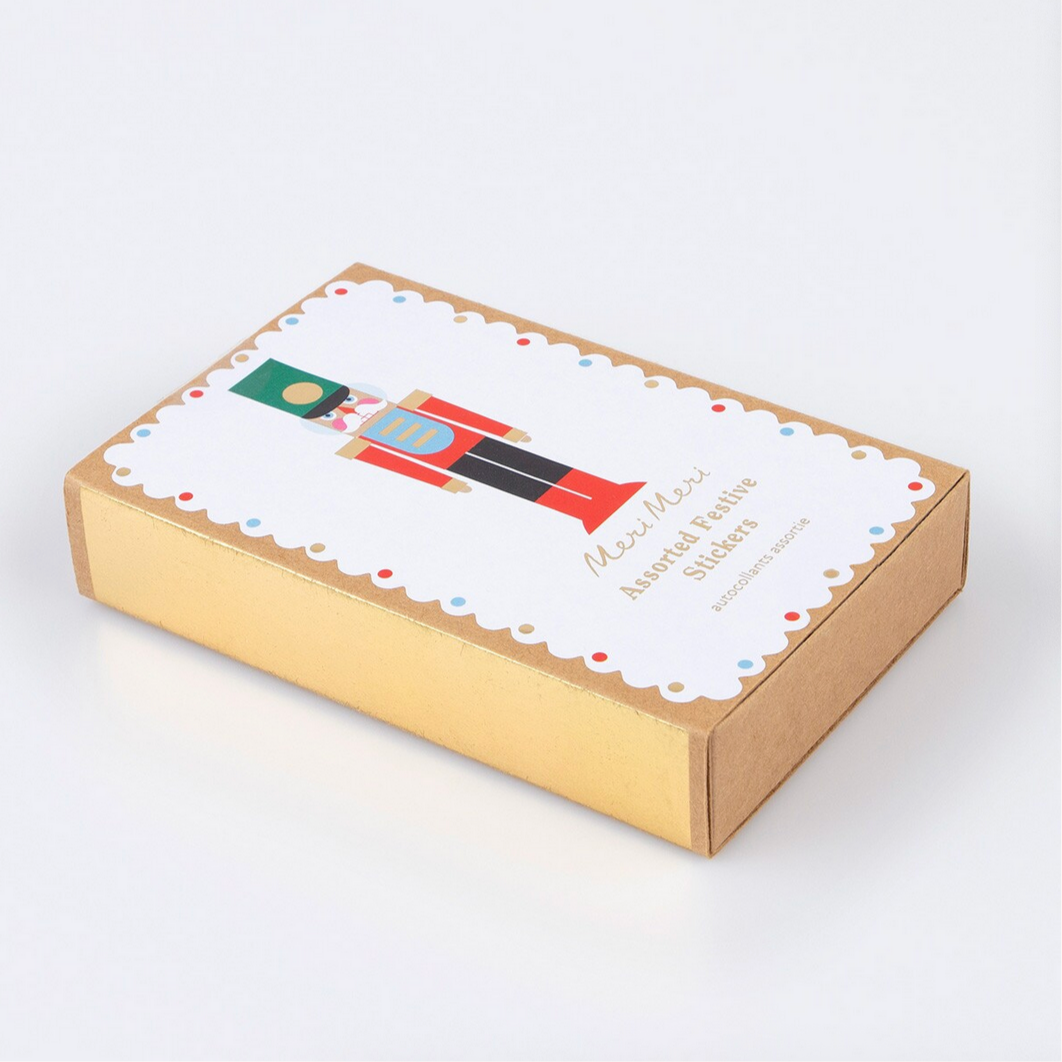 Cardboard box with a decorative label featuring a nutcracker design on a white background