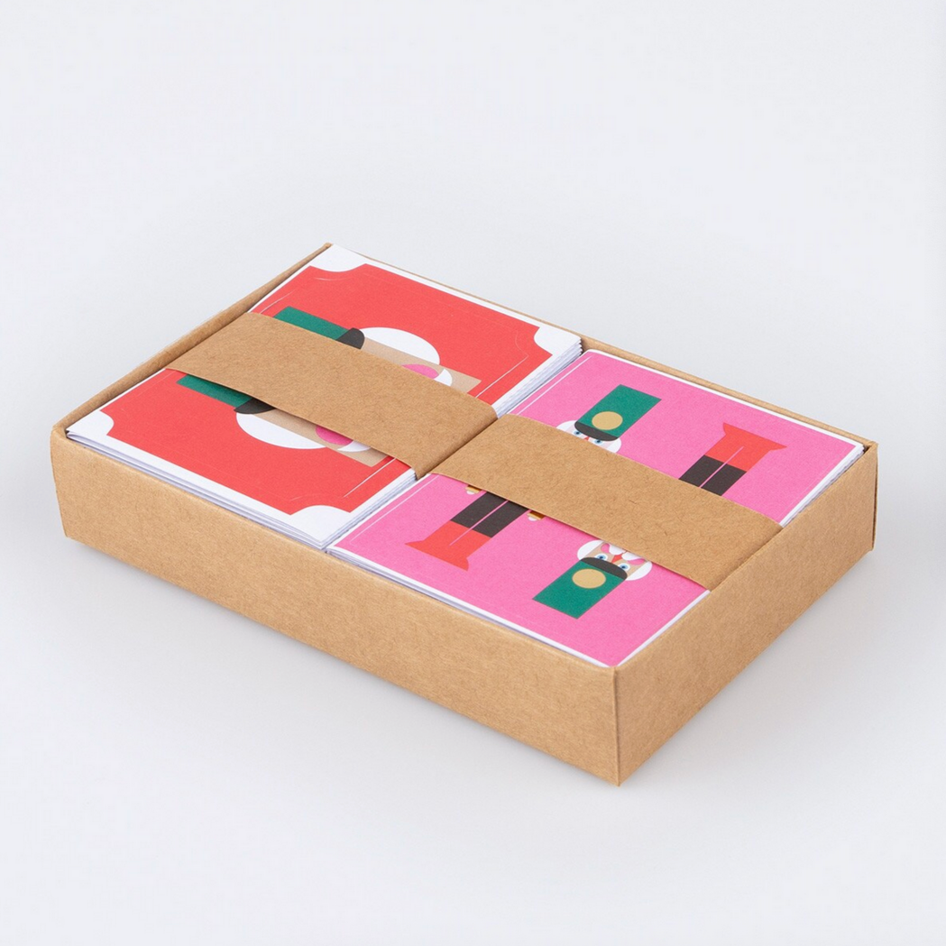Cardboard box with colorful cards inside on a white background