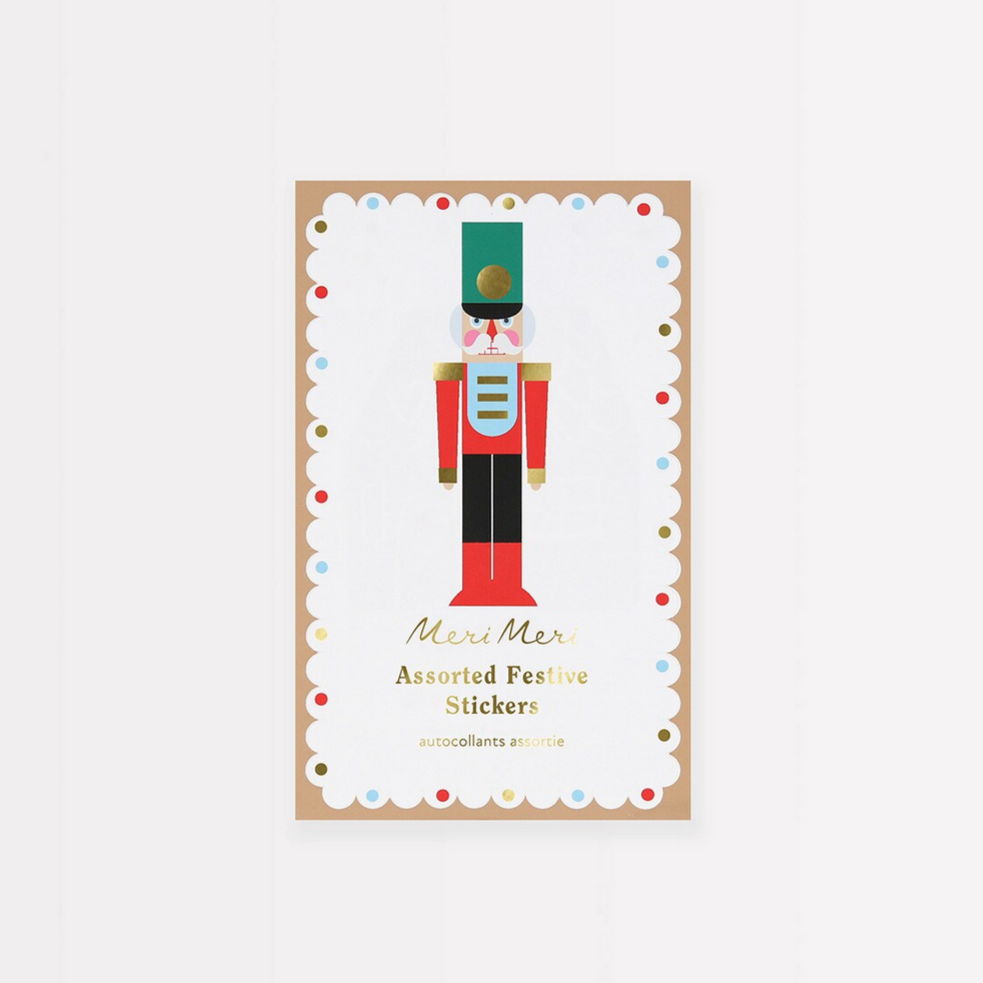 Packaging of festive stickers with a nutcracker design on a white background