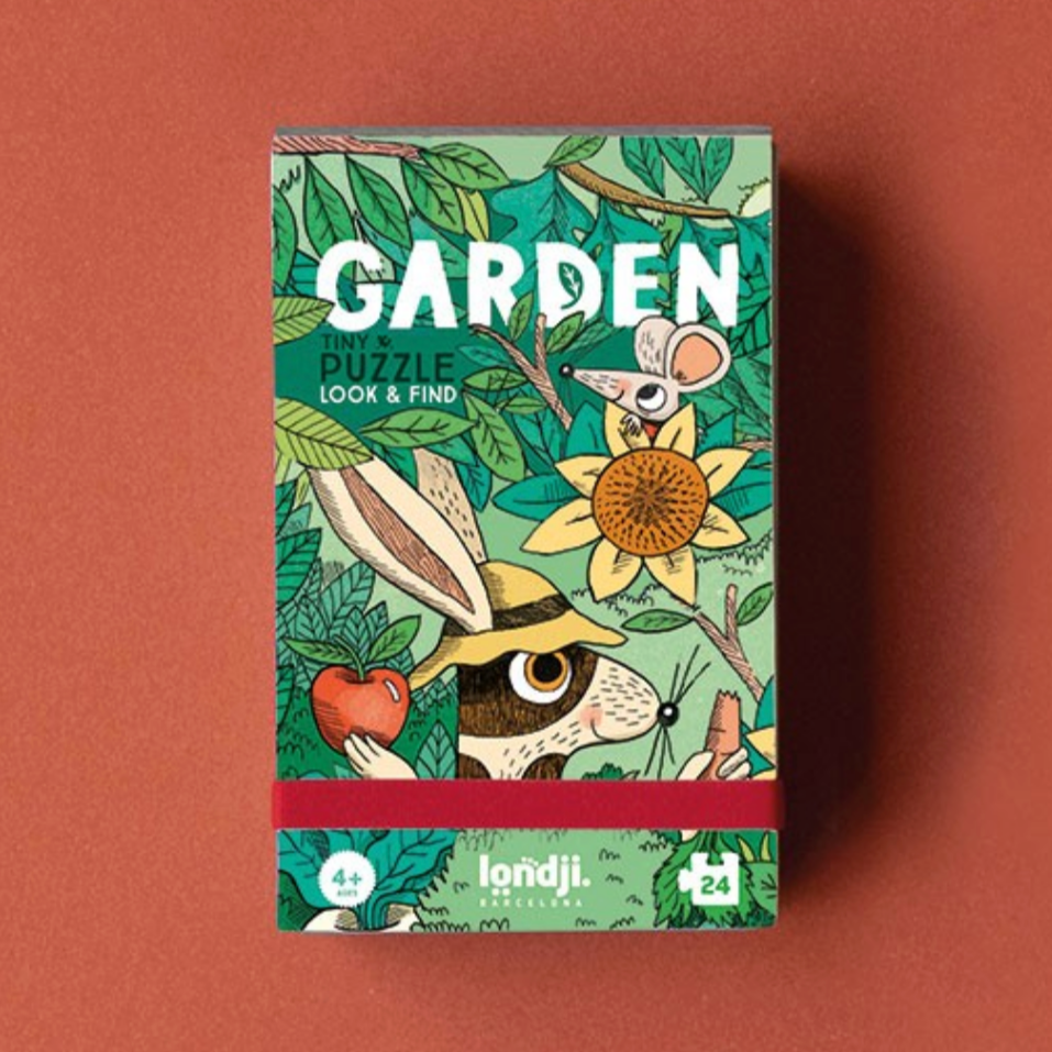 Children's puzzle titled 'Garden' with a rabbit illustration on a brown background