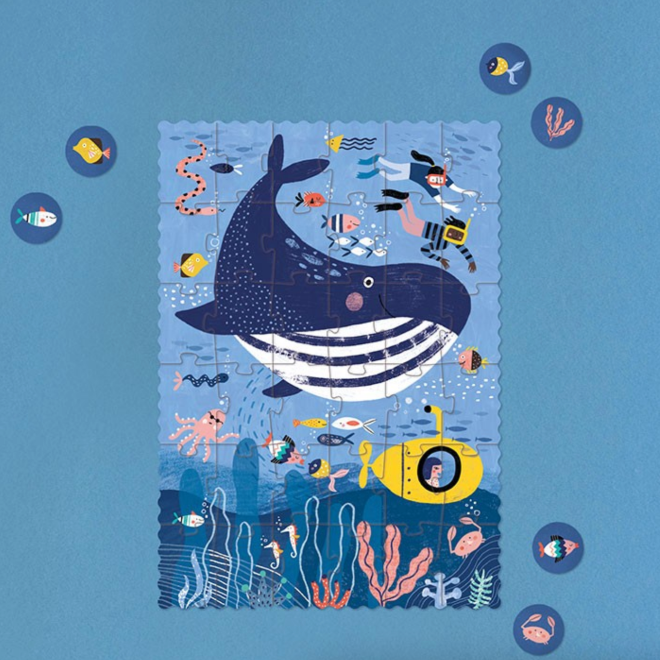 Illustration of a whale and underwater scene with a blue background