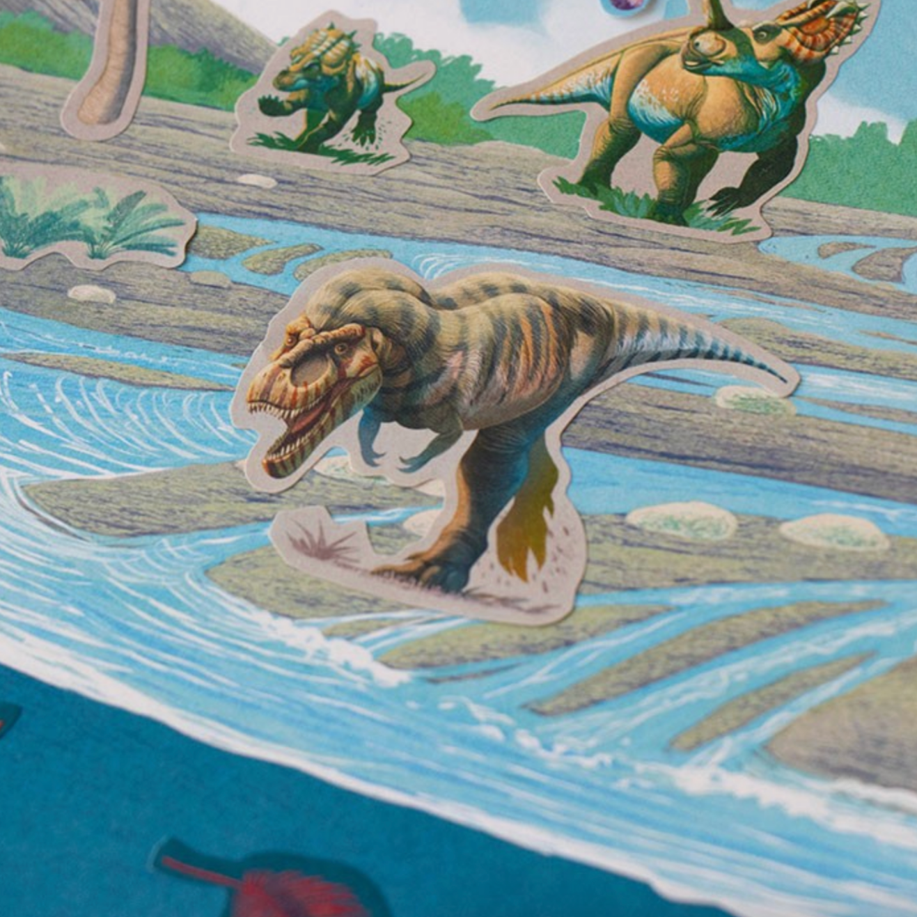 Colorful dinosaur stickers on a children's book page