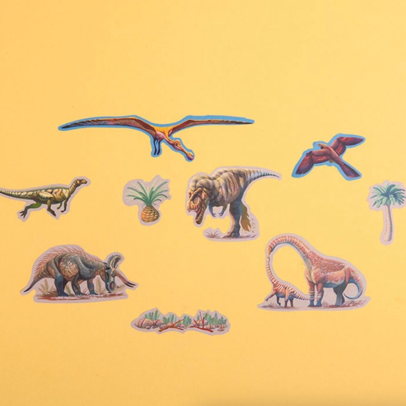 Illustrations of dinosaurs on a yellow background