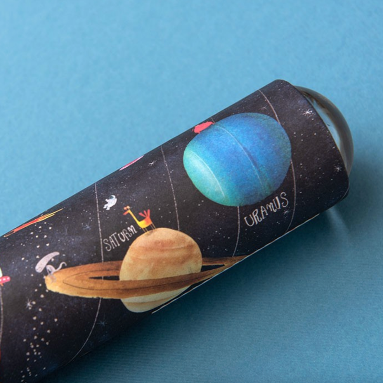 kaleidoscope with space-themed design on a blue background