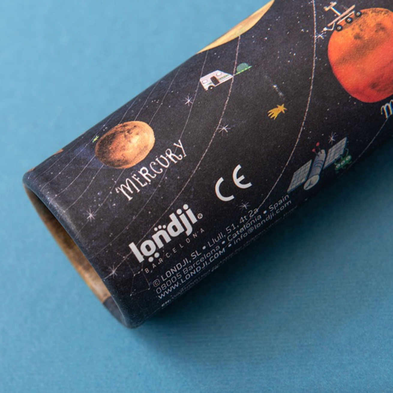 Roll of paper with space-themed design and 'londji' branding on a blue background