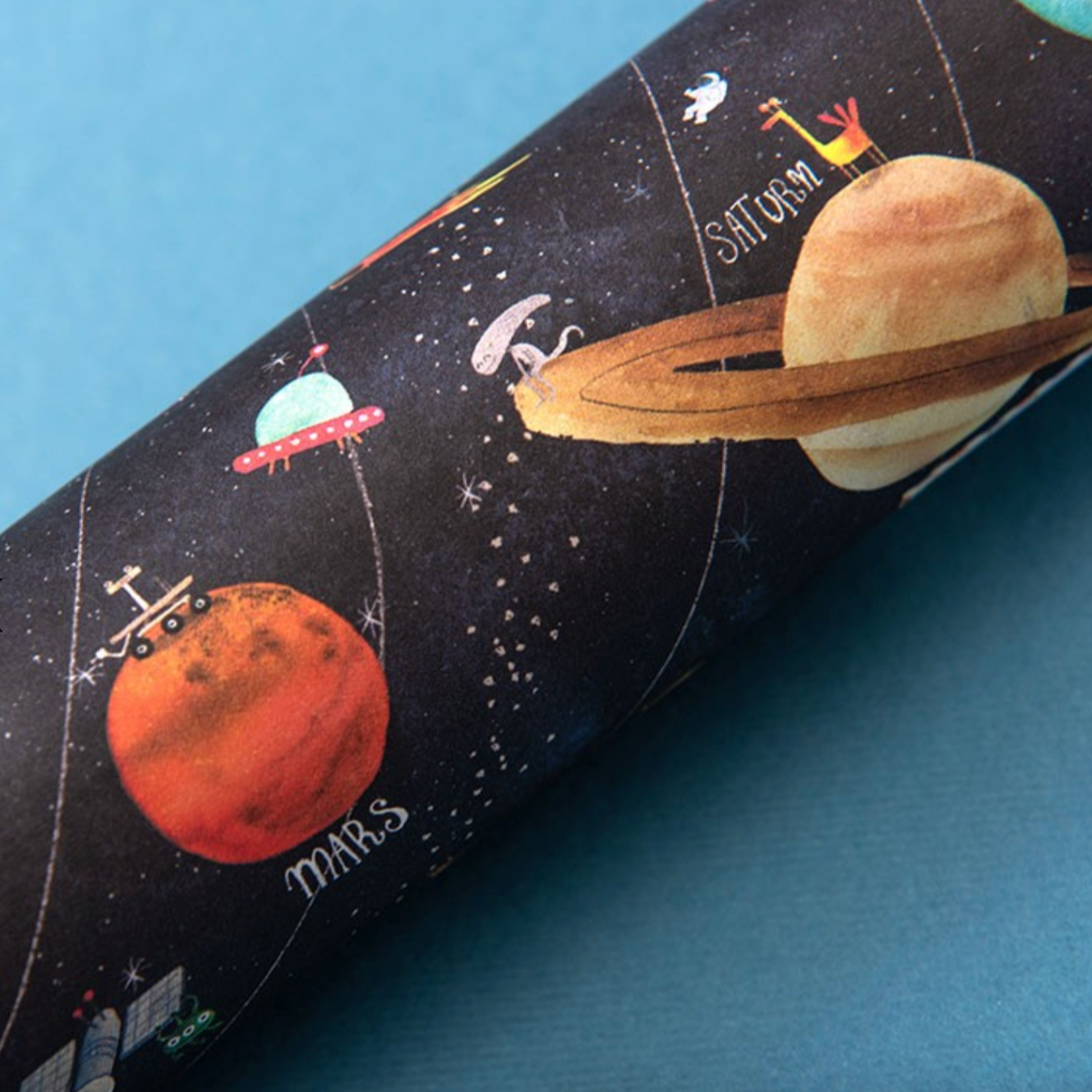 kaleidoscope with space-themed design featuring planets and rockets on a blue background.