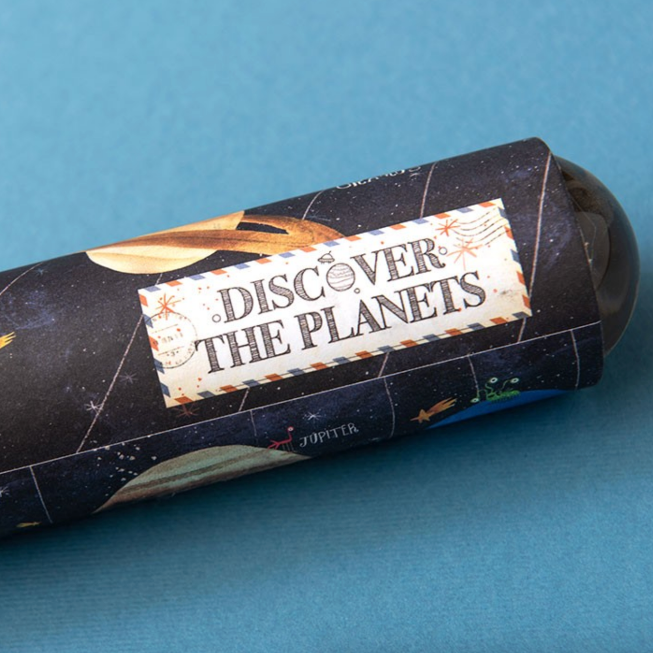  cylindrical kaleidoscope with 'Discover the Planets' text on a blue background