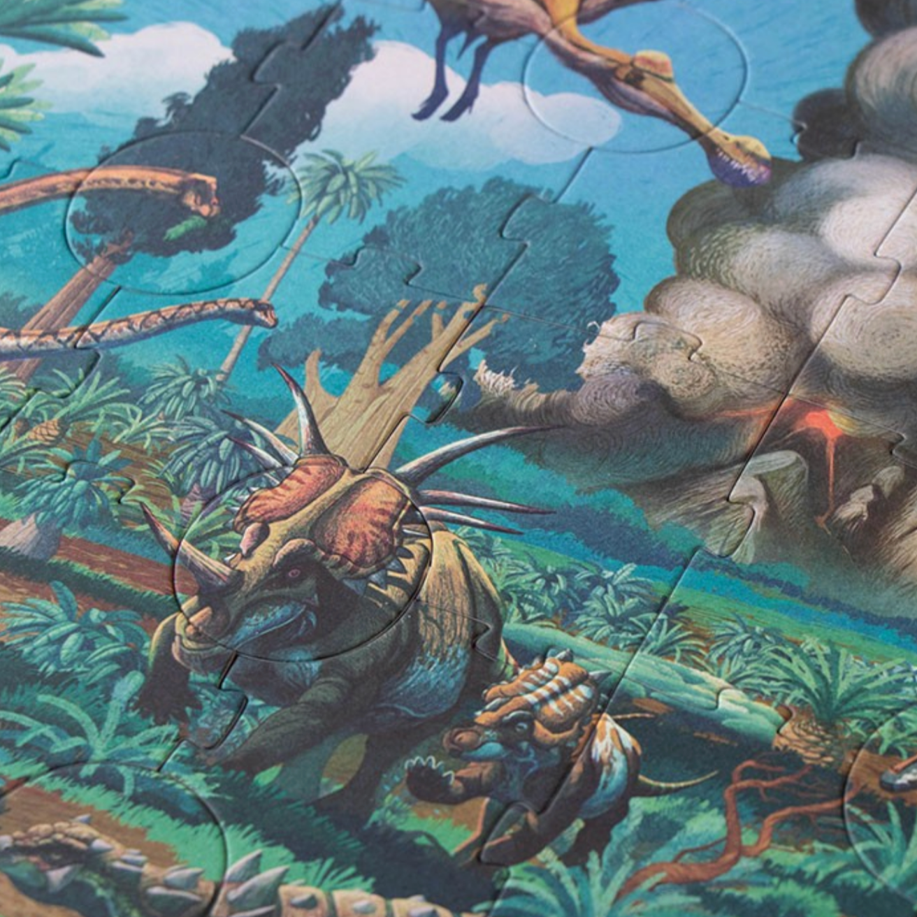 Jigsaw puzzle with a prehistoric scene featuring dinosaurs and plants.