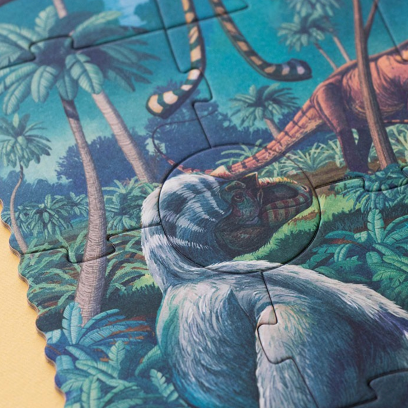 Jigsaw puzzle with a completed section showing a sloth in a jungle setting