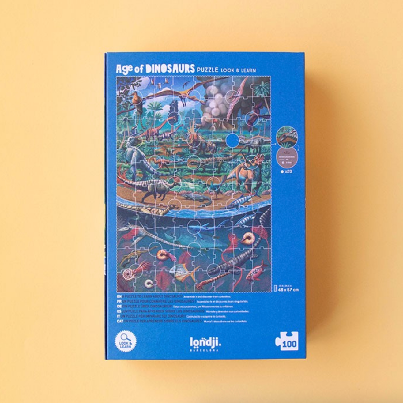 Jigsaw puzzle box titled 'Age of Dinosaurs' on a beige background