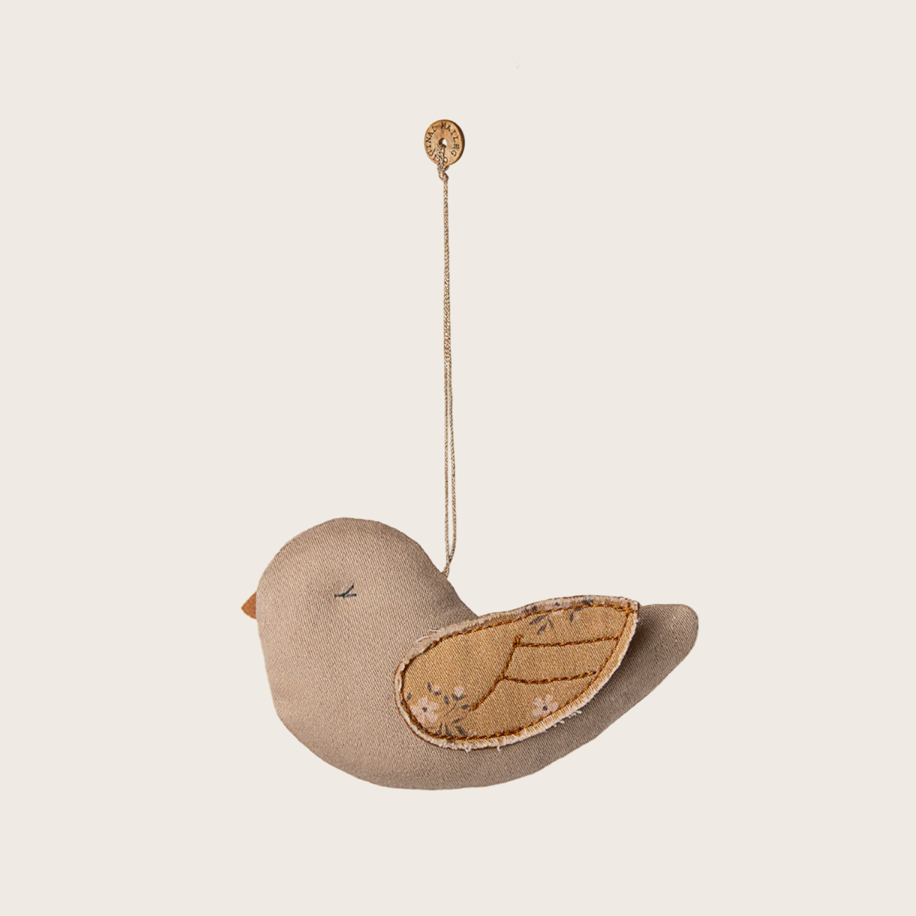 Decorative bird ornament on a white background with 'maileg' branding.