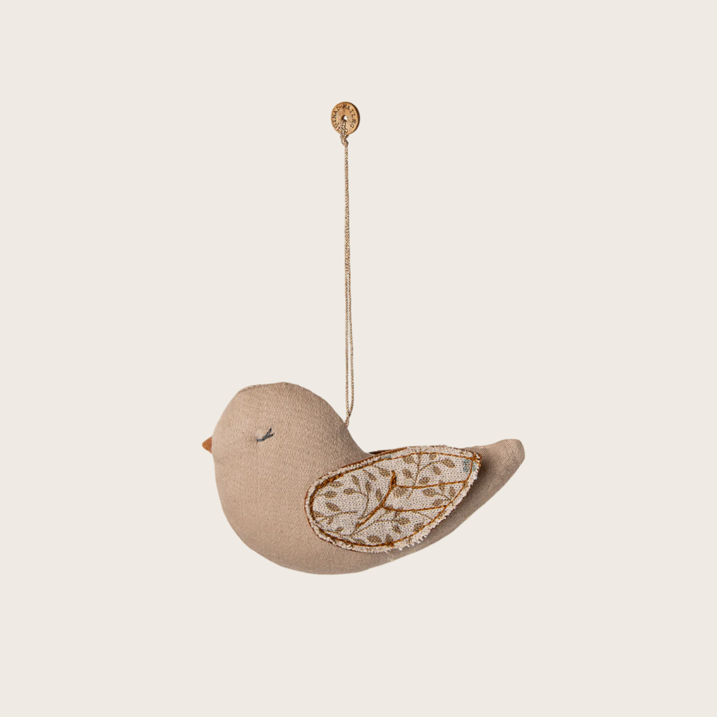 Decorative bird ornament on a website with 'Maileg' branding