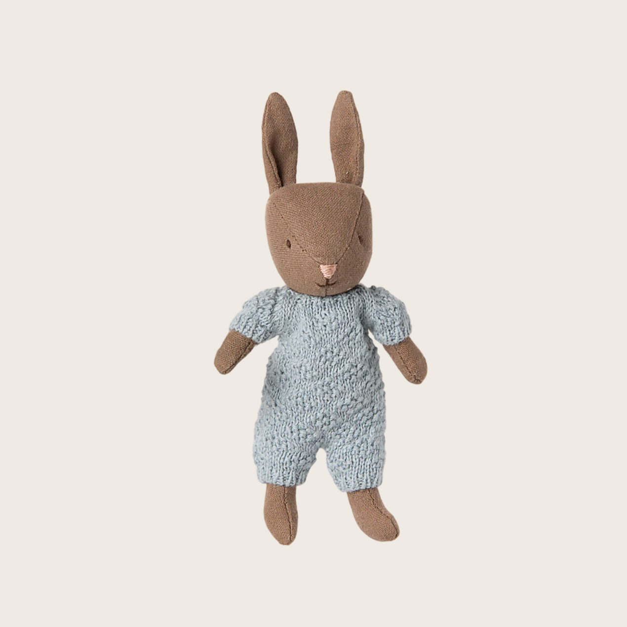 Stuffed rabbit toy in a blue outfit on a website page with product details.