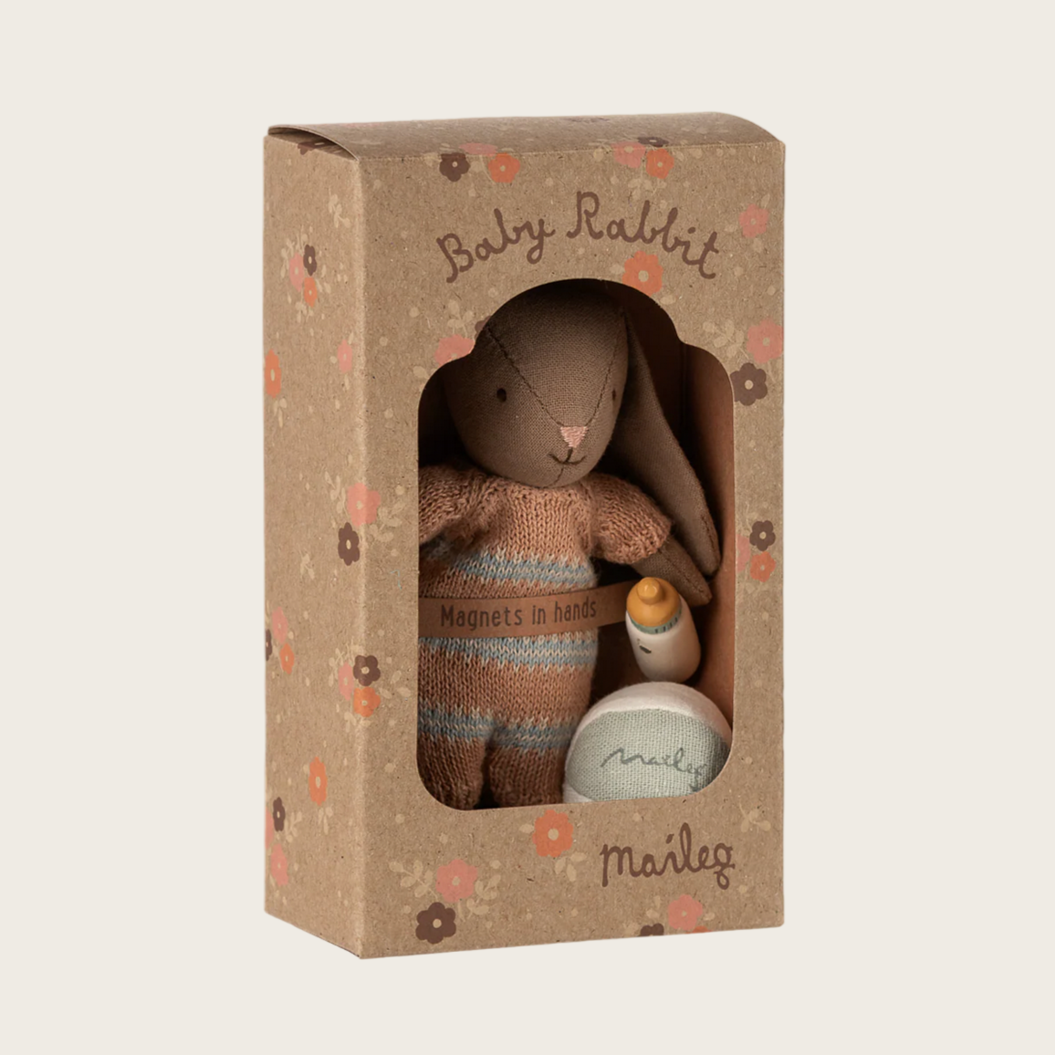 Maileg toy rabbit in a cardboard box with floral patterns on a white background