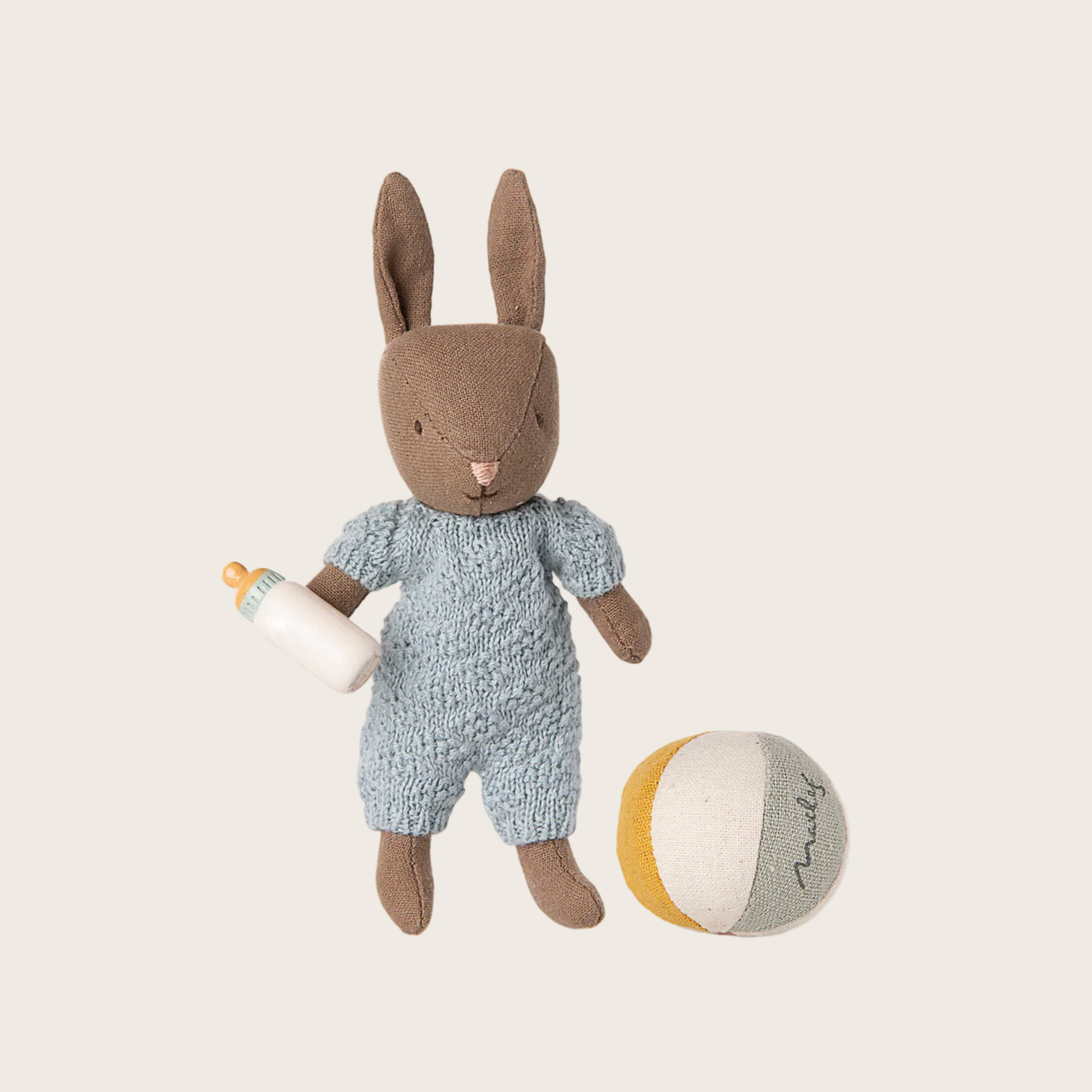 Toy rabbit in a blue outfit with a ball 