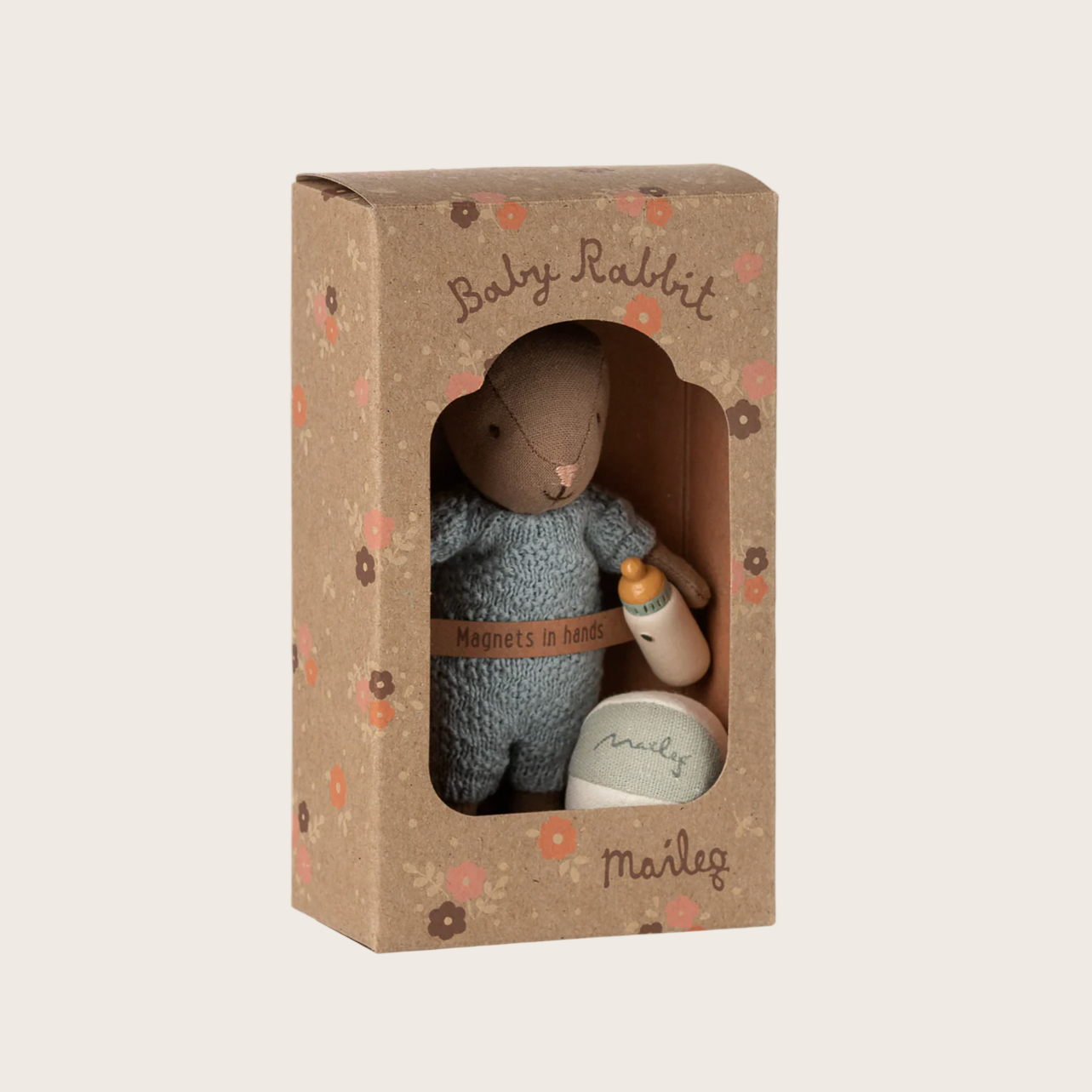 Toy rabbit in a box with packaging featuring 'Maileg' branding on a website background.