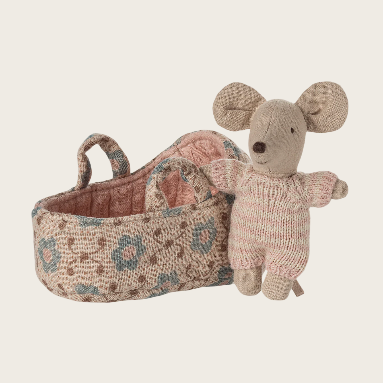 Baby mouse in a carrycot with floral pattern 