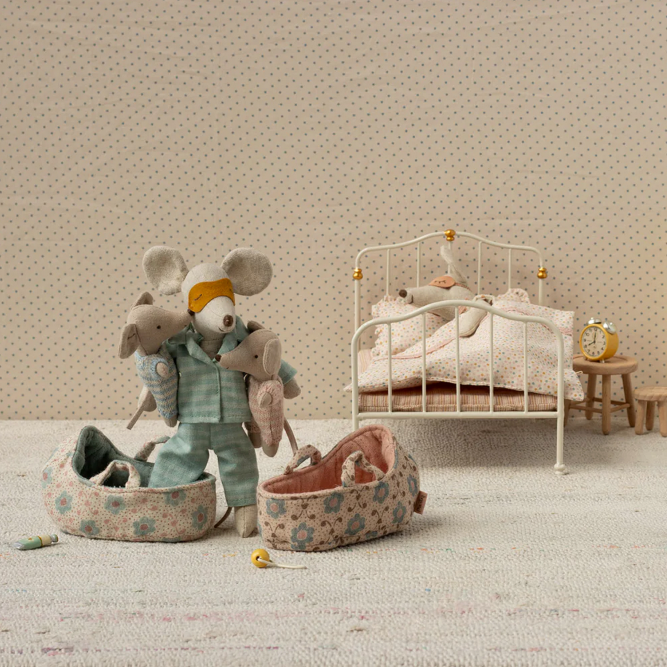 Children's room with toys and a crib in a neutral color scheme