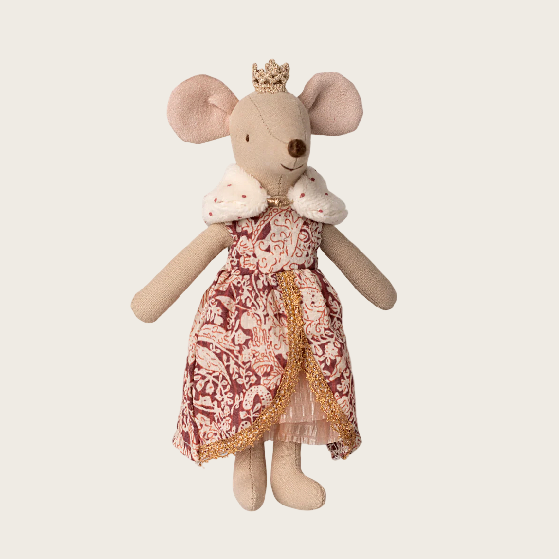 Stuffed toy mouse in a dress with a crown on a white background