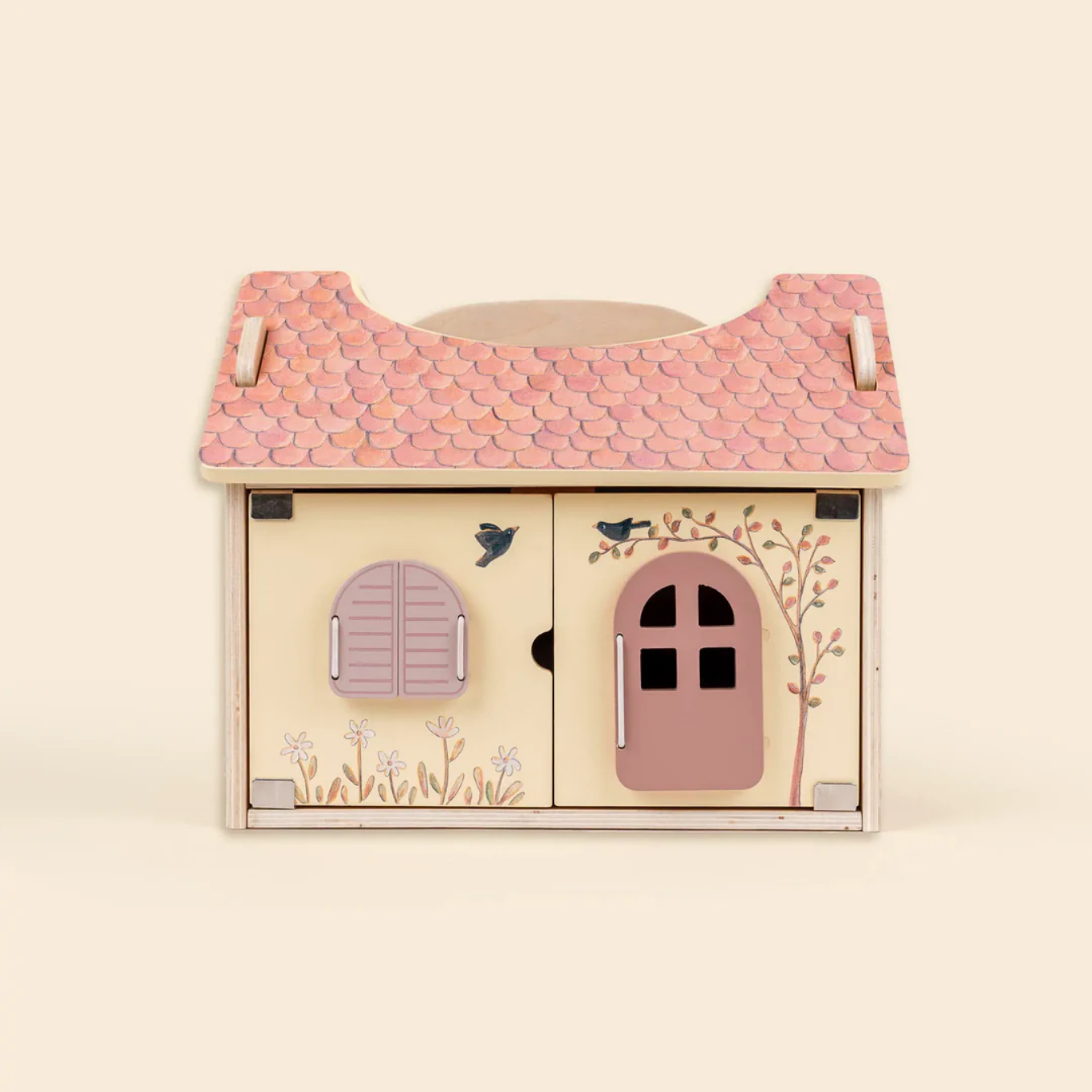 Wooden toy house with pink roof and doors on a beige background