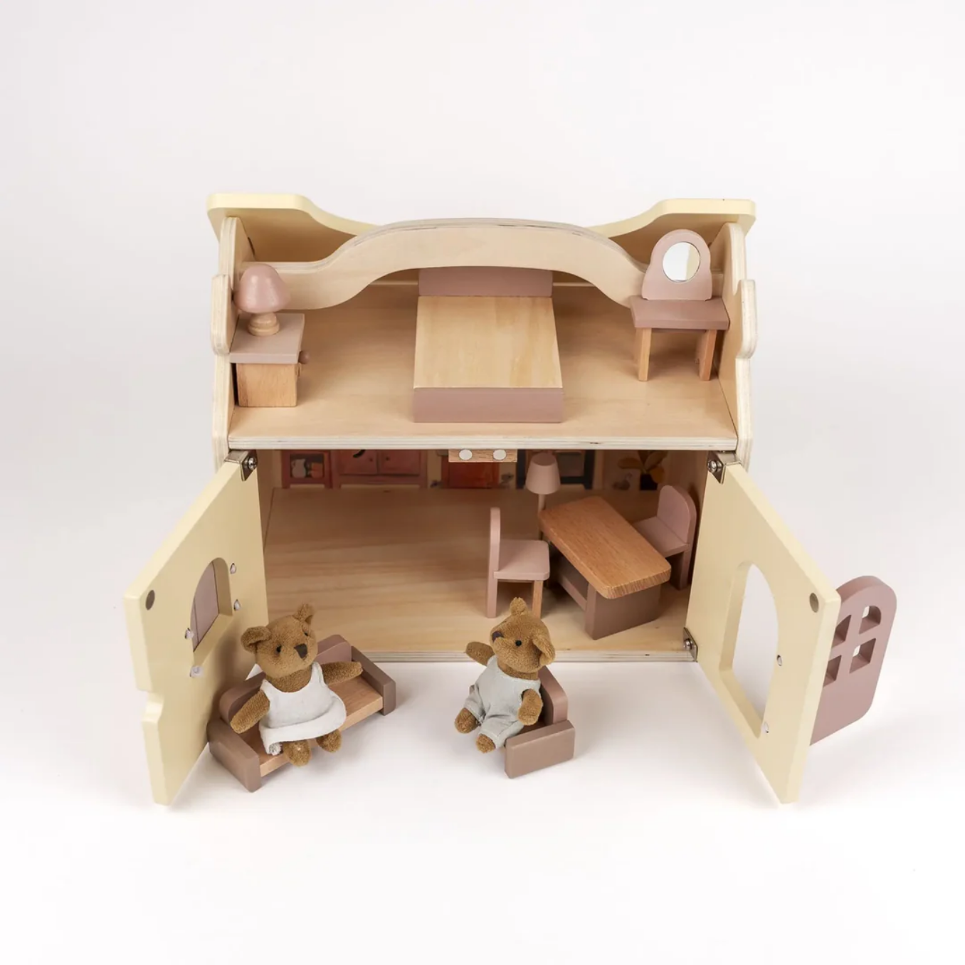 Wooden dollhouse with furniture and teddy bears on a white background