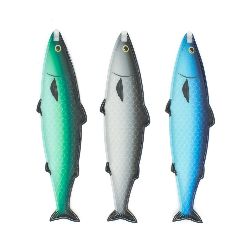 Three fish-shaped toys in green, gray, and blue on a white background