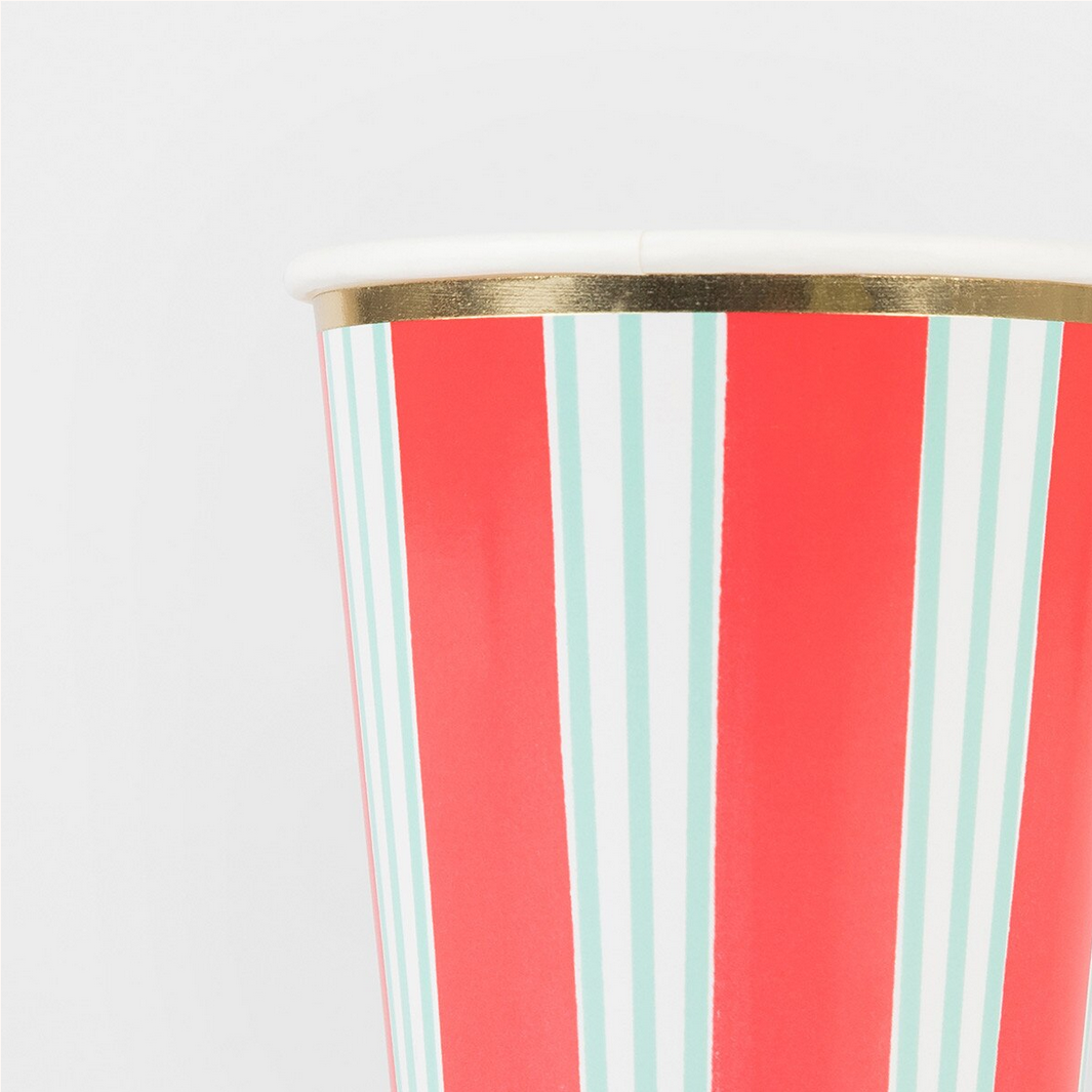 Striped cup with red and light blue vertical stripes on a white background