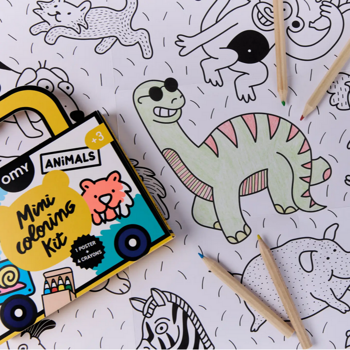 Coloring kit with pencils and coloring book on a sheet with animal illustrations