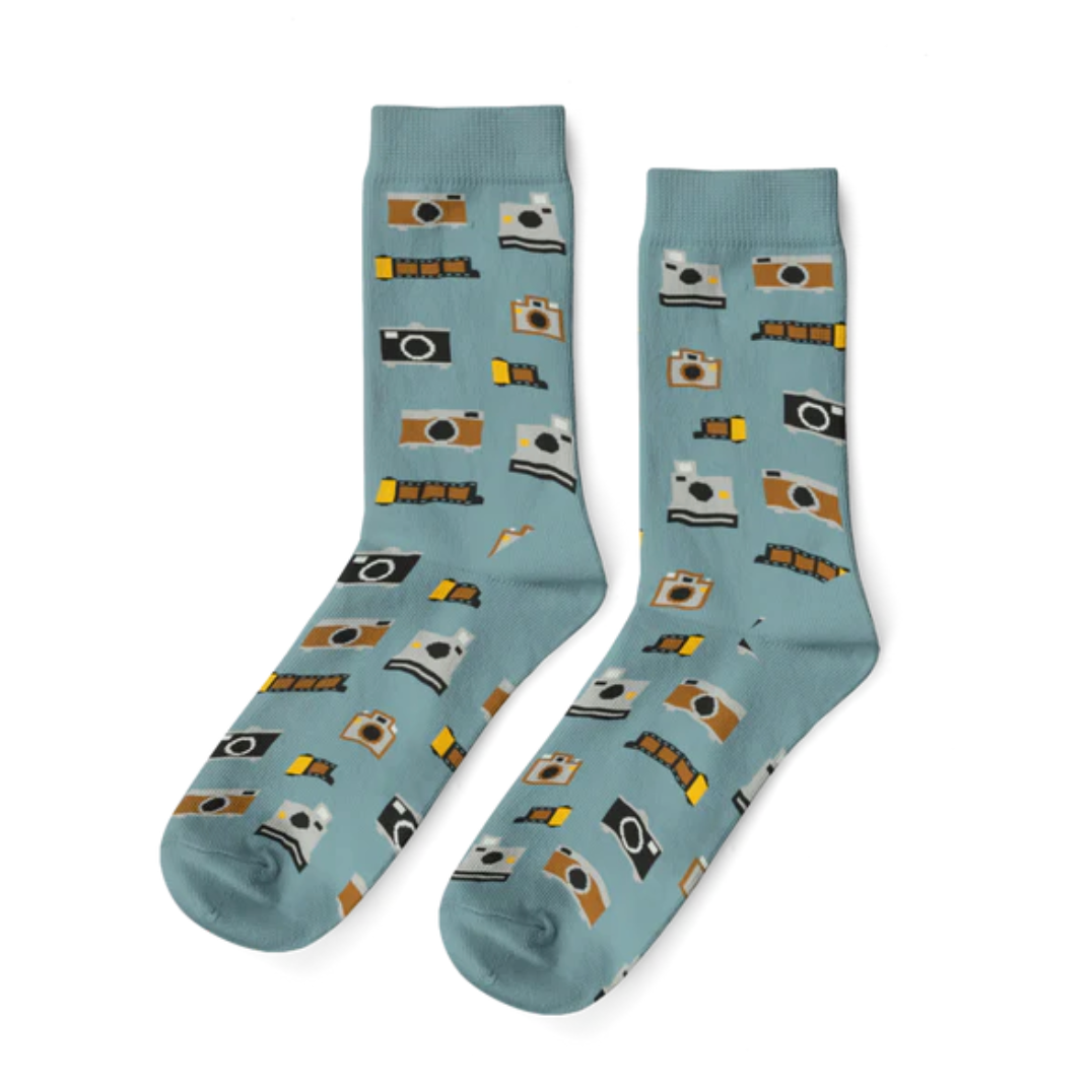 Pair of socks with camera pattern on a light blue background