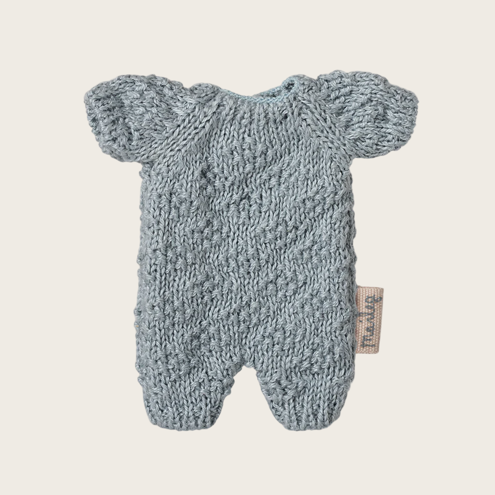 Knitted baby outfit on a website page with product details.