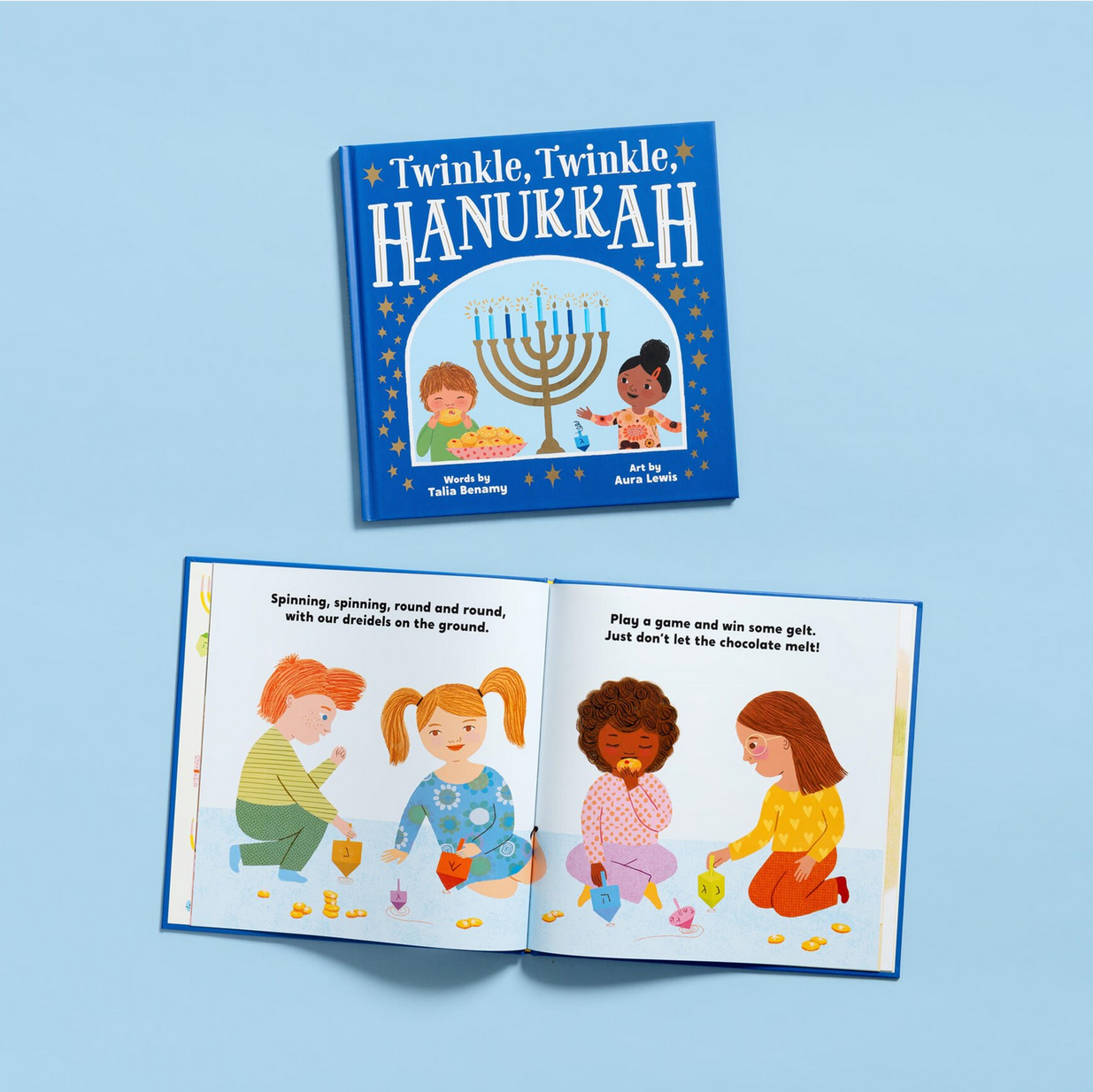 Children's book titled 'Twinkle, Twinkle Hanukkah' on a blue background