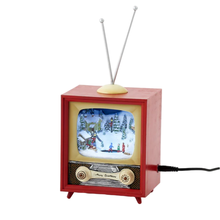 Small red vintage-style television set with a snowy scene on the screen against a white background