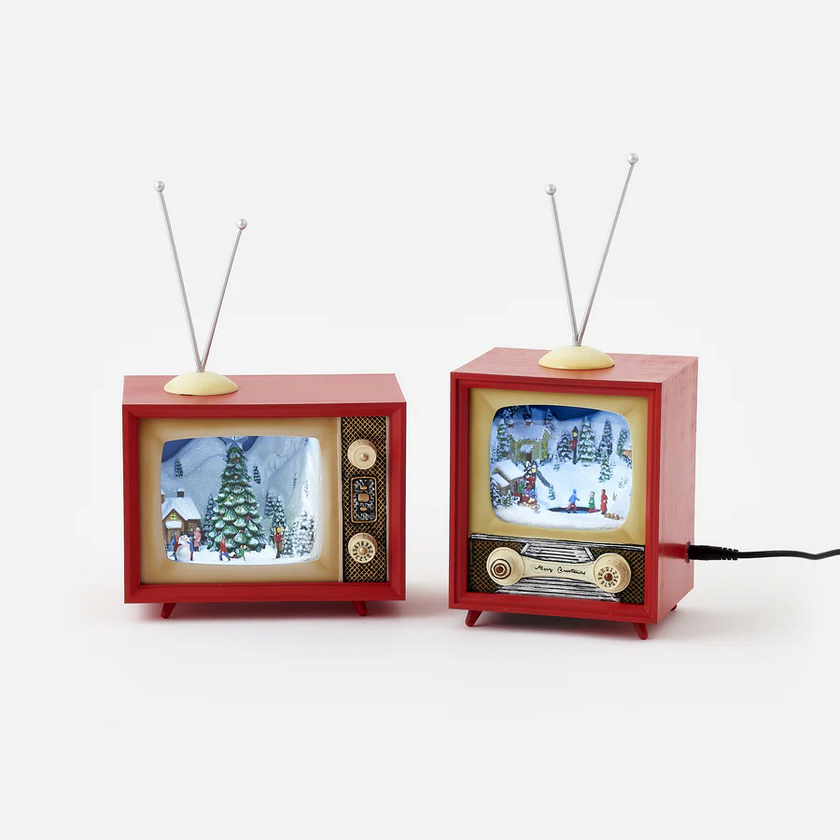 Two miniature red vintage TVs displaying Christmas-themed scenes on a white background