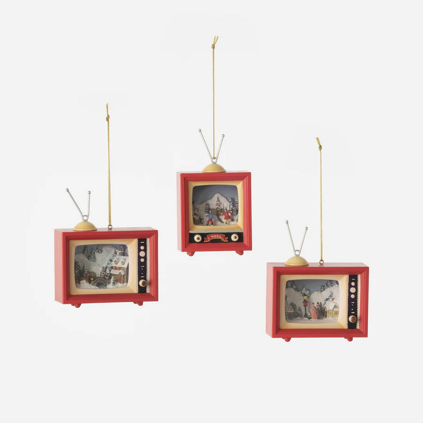 Three miniature red vintage TVs with screens displaying different scenes on a white background