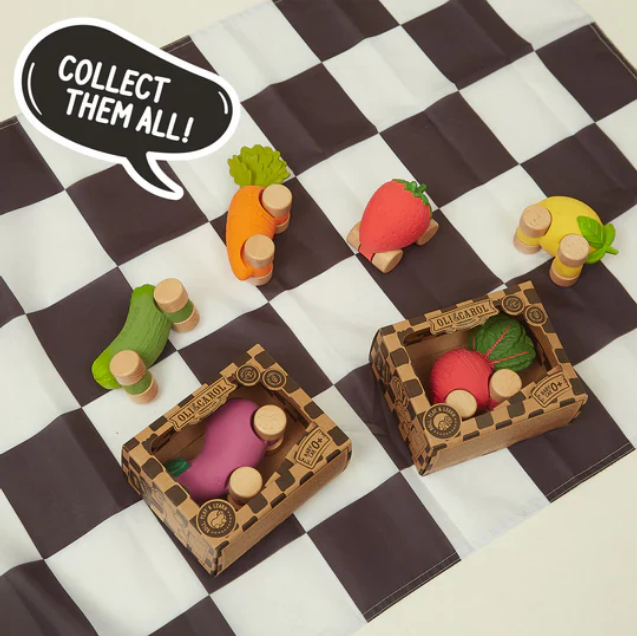 Wooden toy vegetables on a checkered surface with 'Collect Them All!' text.