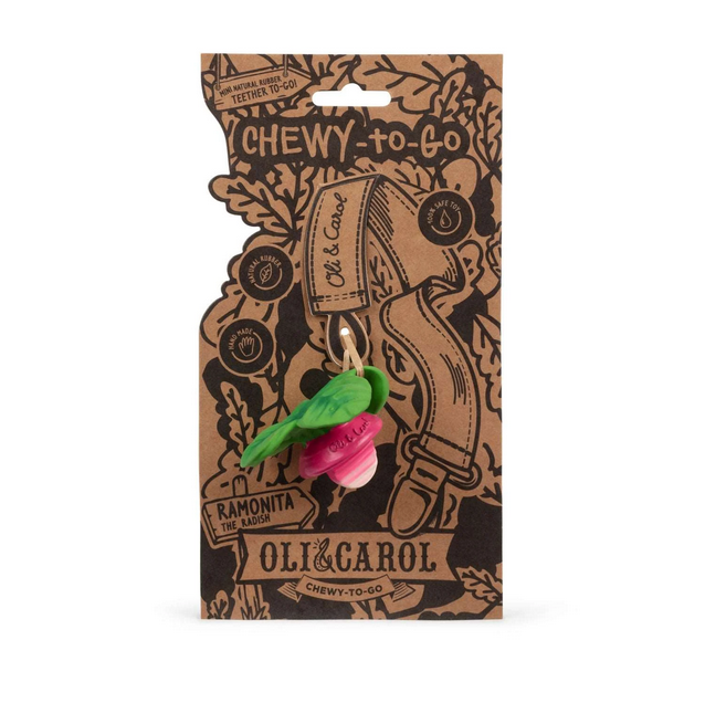 Oli & Carol chew toy packaging with a pink and green teething toy inside on a white background.