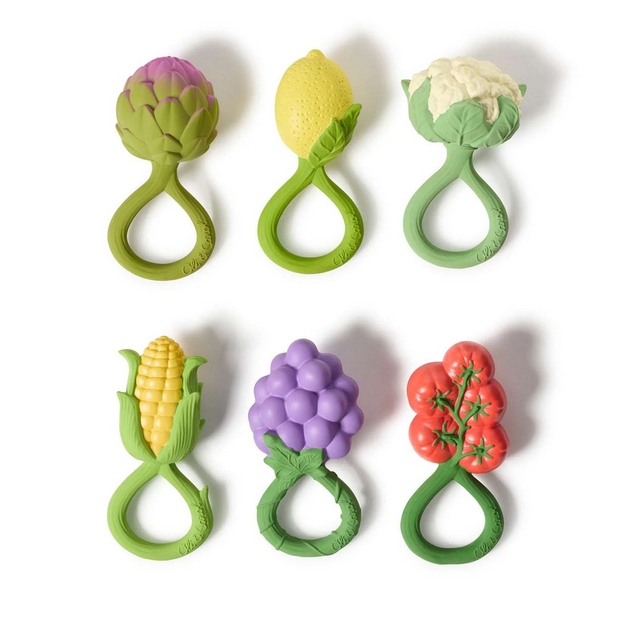Set of six vegetable-shaped teething toys on a white background