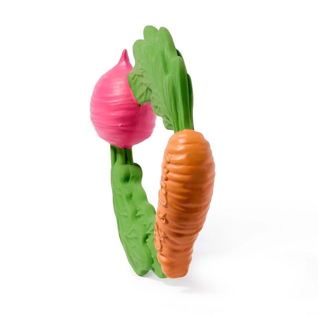 Pink radish and orange carrot toys with green stems on a white background