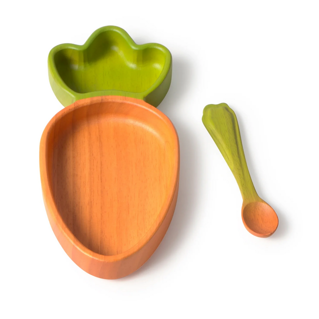 Carrot-shaped wooden plate and spoon set on a white background
