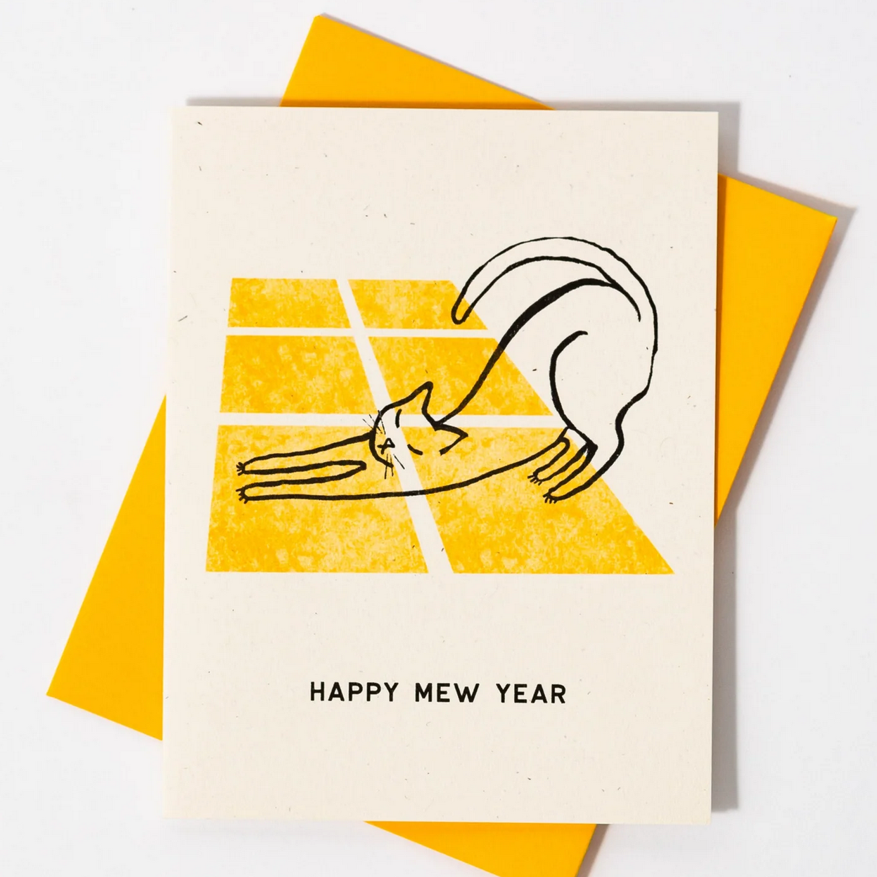 Greeting card with a hand-drawn illustration of a cat reaching out and 'Happy New Year' text, on a yellow background.