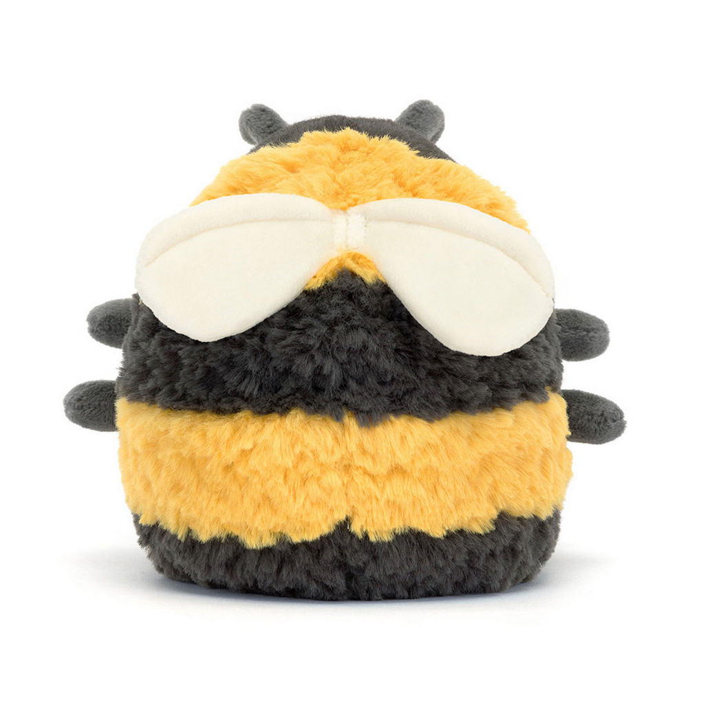 Plush toy bee with a white face on a white background