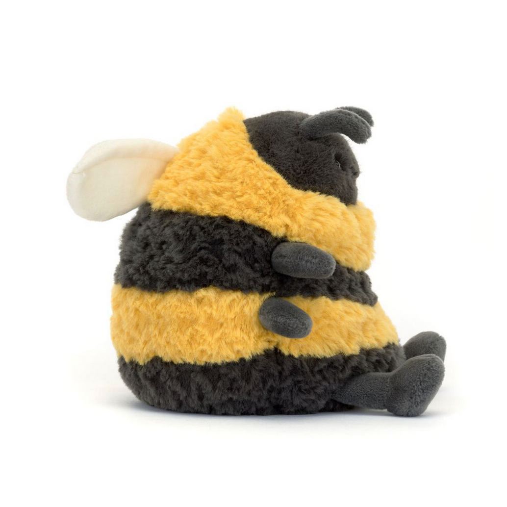 Plush toy bee with black and yellow stripes on a white background