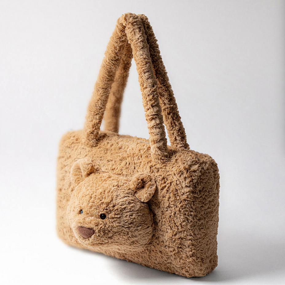Fluffy bear-shaped tote bag on a website with product details.