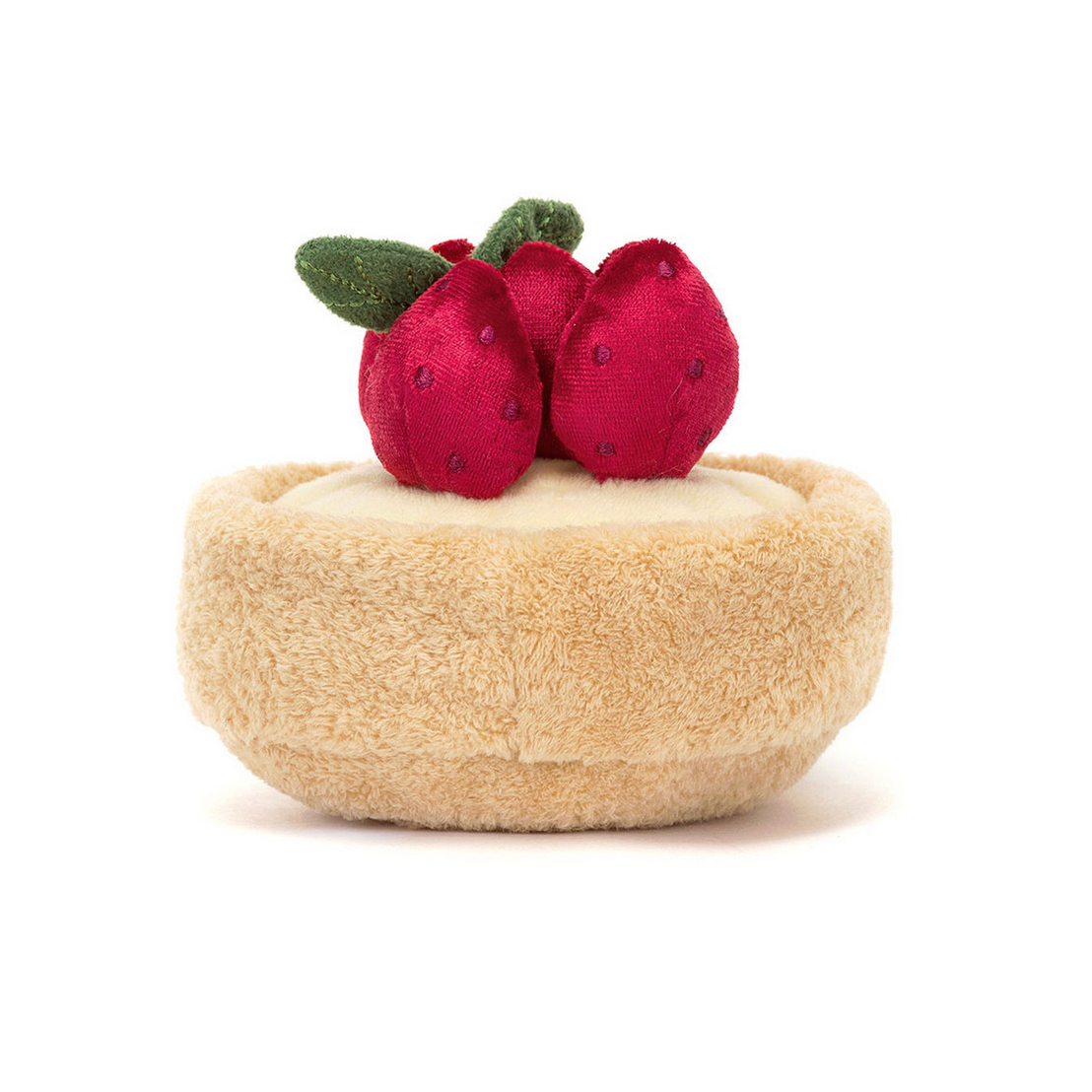 Toy tart with red berries on a white background