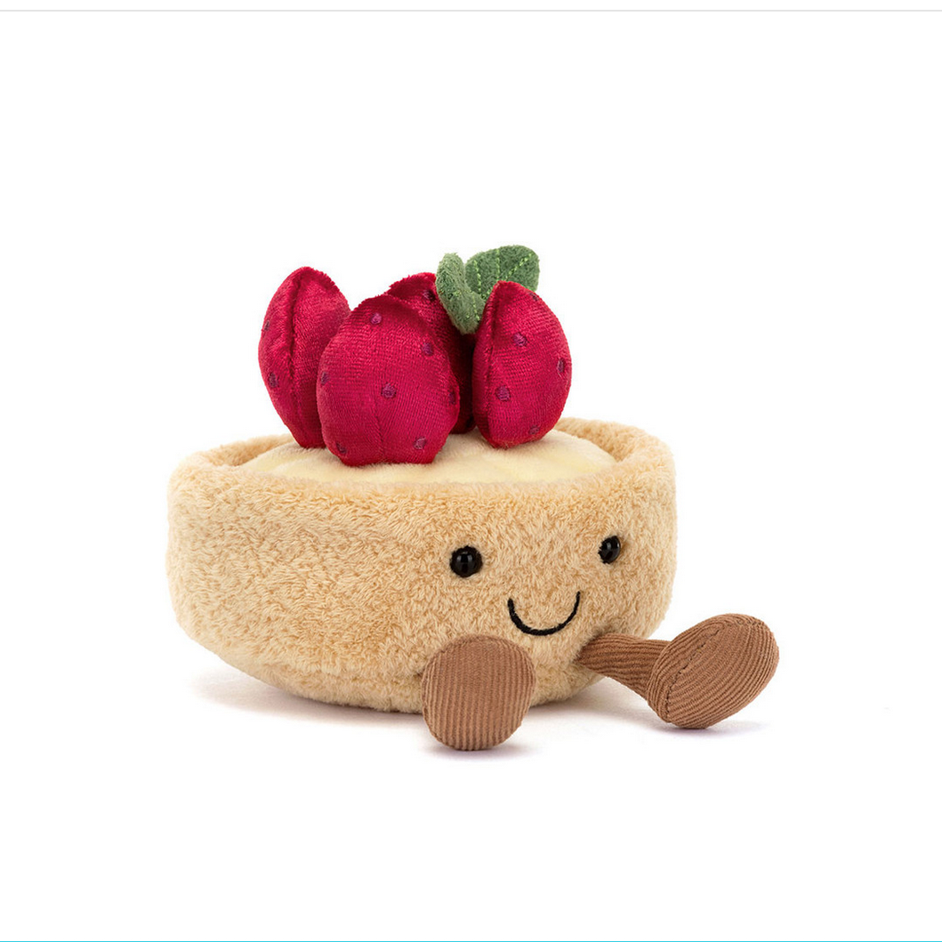 Toy tart with strawberry on a white background